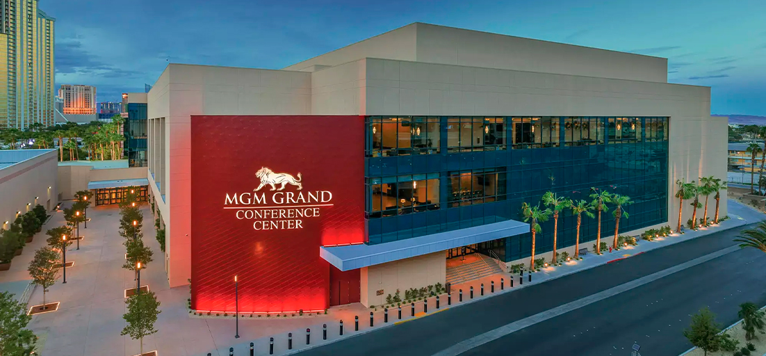Exterior view of the MGM Grand Conference Center in Las Vegas with red and glass facade.