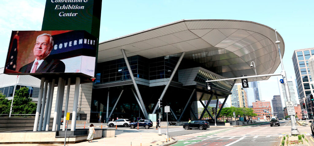 Exterior view of the Boston Convention and Exhibition Center with large digital display screen.
