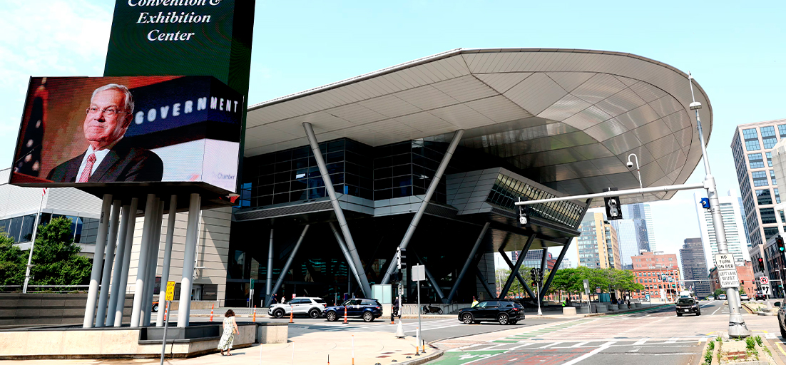 Exterior view of the Boston Convention and Exhibition Center with large digital display screen.