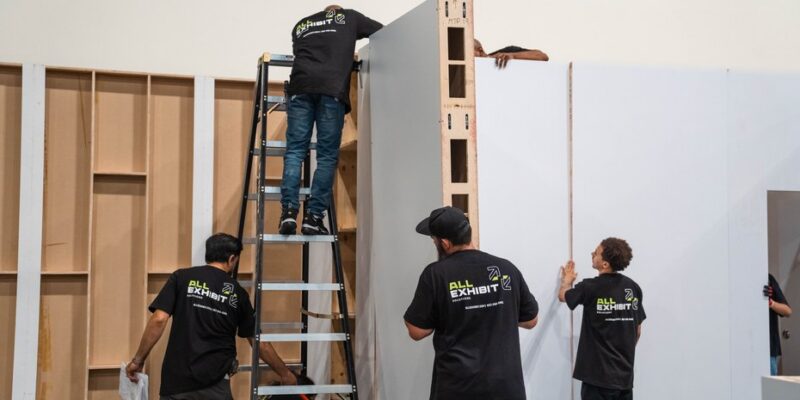 Crew installing large-format graphics on the Olive Young FESTA activation