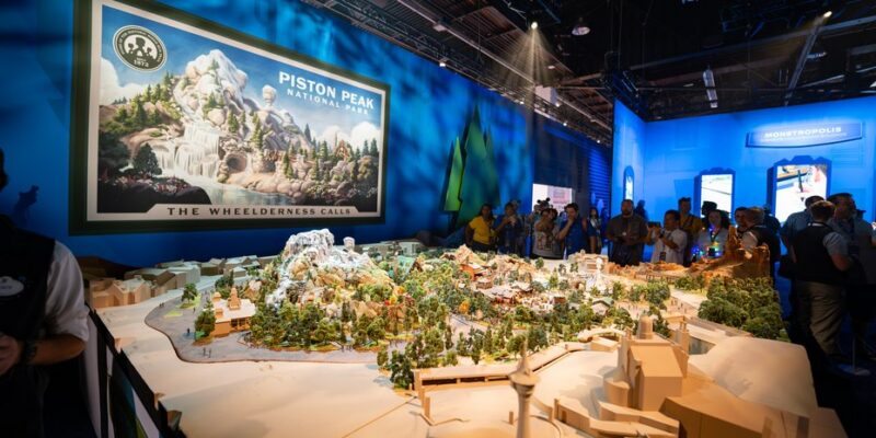 Large scale attraction model on a custom plinth inside a themed zone of the Imagineering pavilion