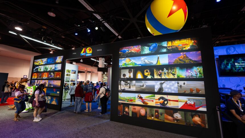 Wide view of the Pixar 40th anniversary backlit wall on the D23 2026 show floor